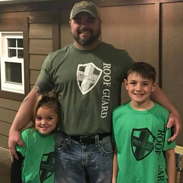 Roof Guard owner, Dion Hancock, with his two kids